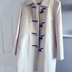 Woman’s beige winter coat size Large.